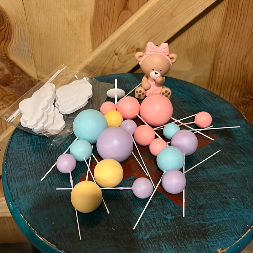 New in box Bear in pink dress cake topper with multicolor balloons and clouds